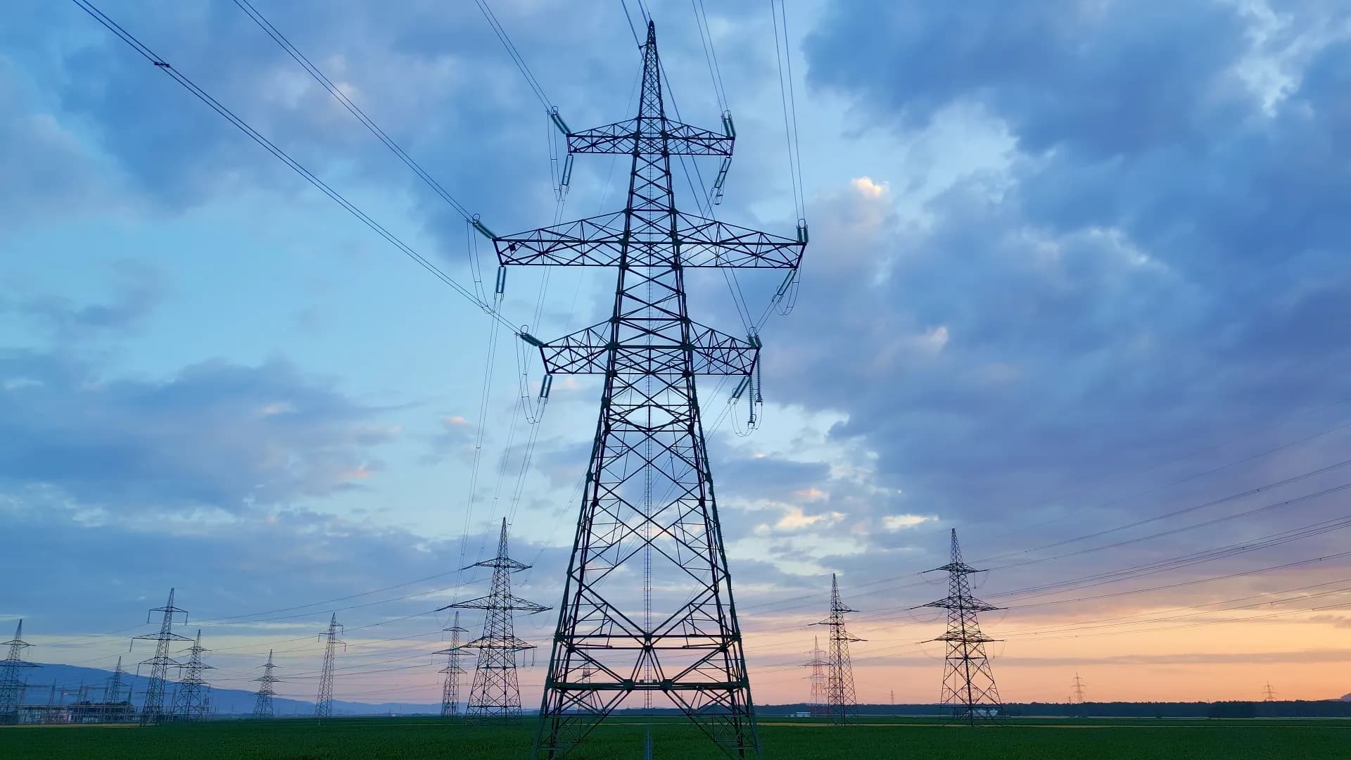 Electricity transmission pylons at sunset